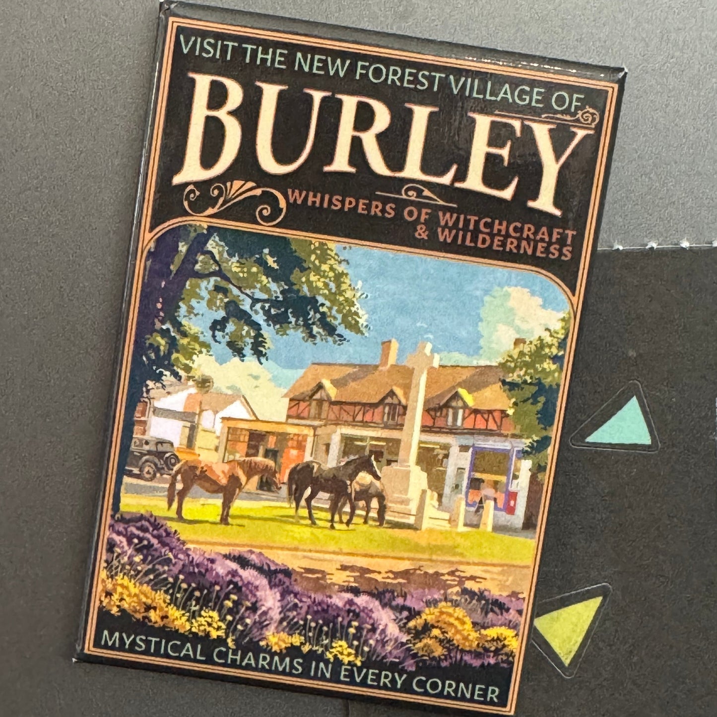 Burley 1930s Travel Magnet on Fridge Holding Up Paper