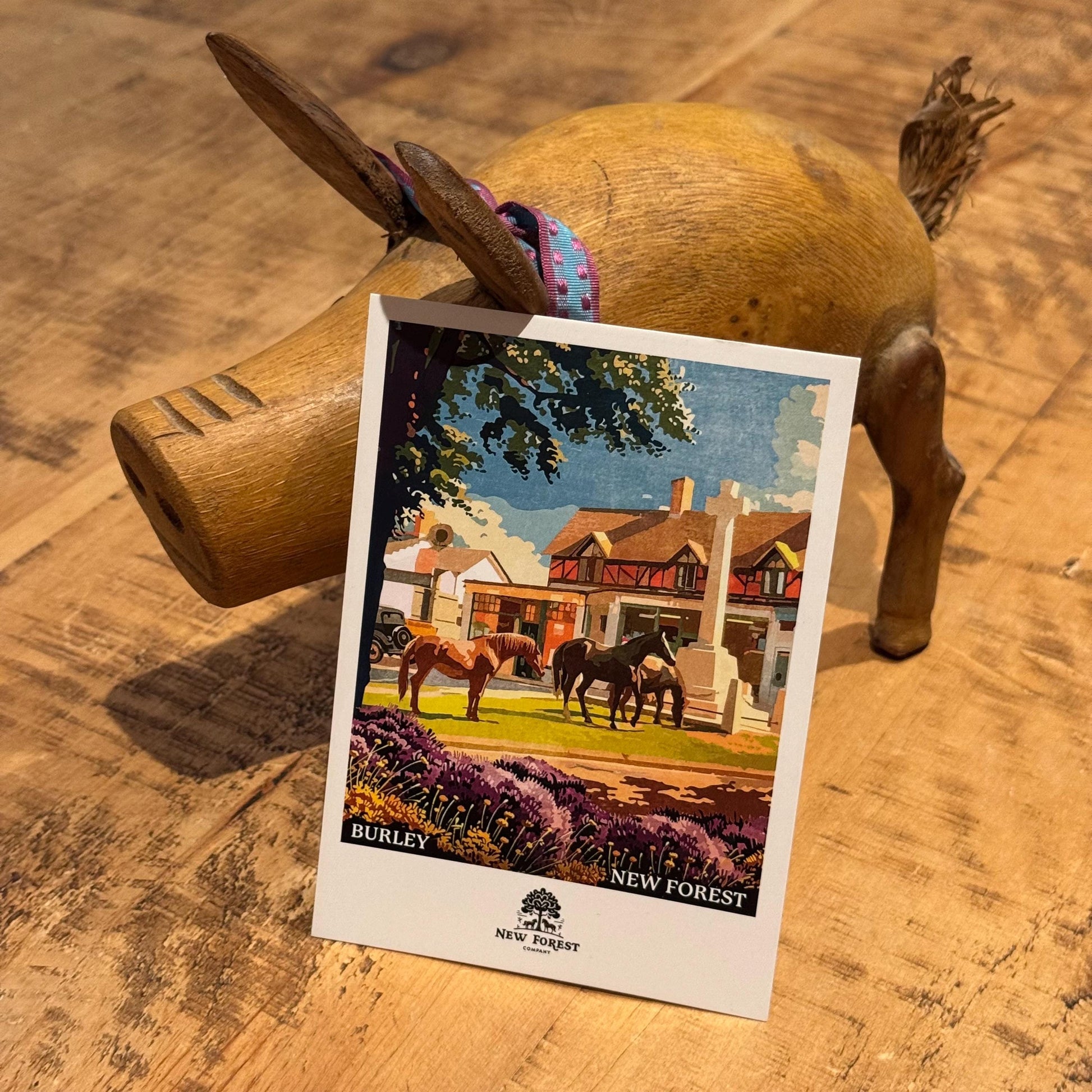 Burley Polaroid Postcard on Desk Against Pig