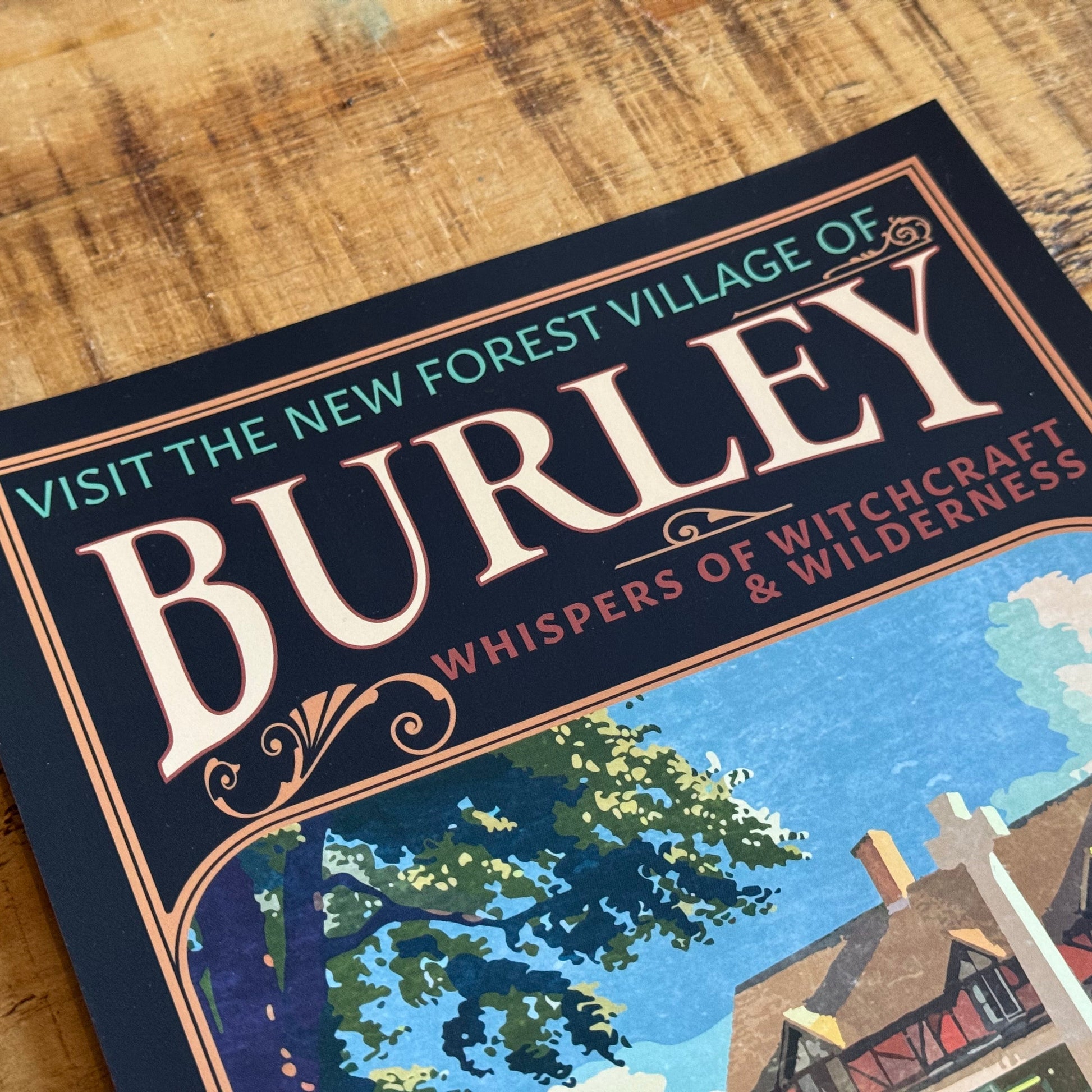 Promotional leaflet for the New Forest Village of Burley on a wooden surface