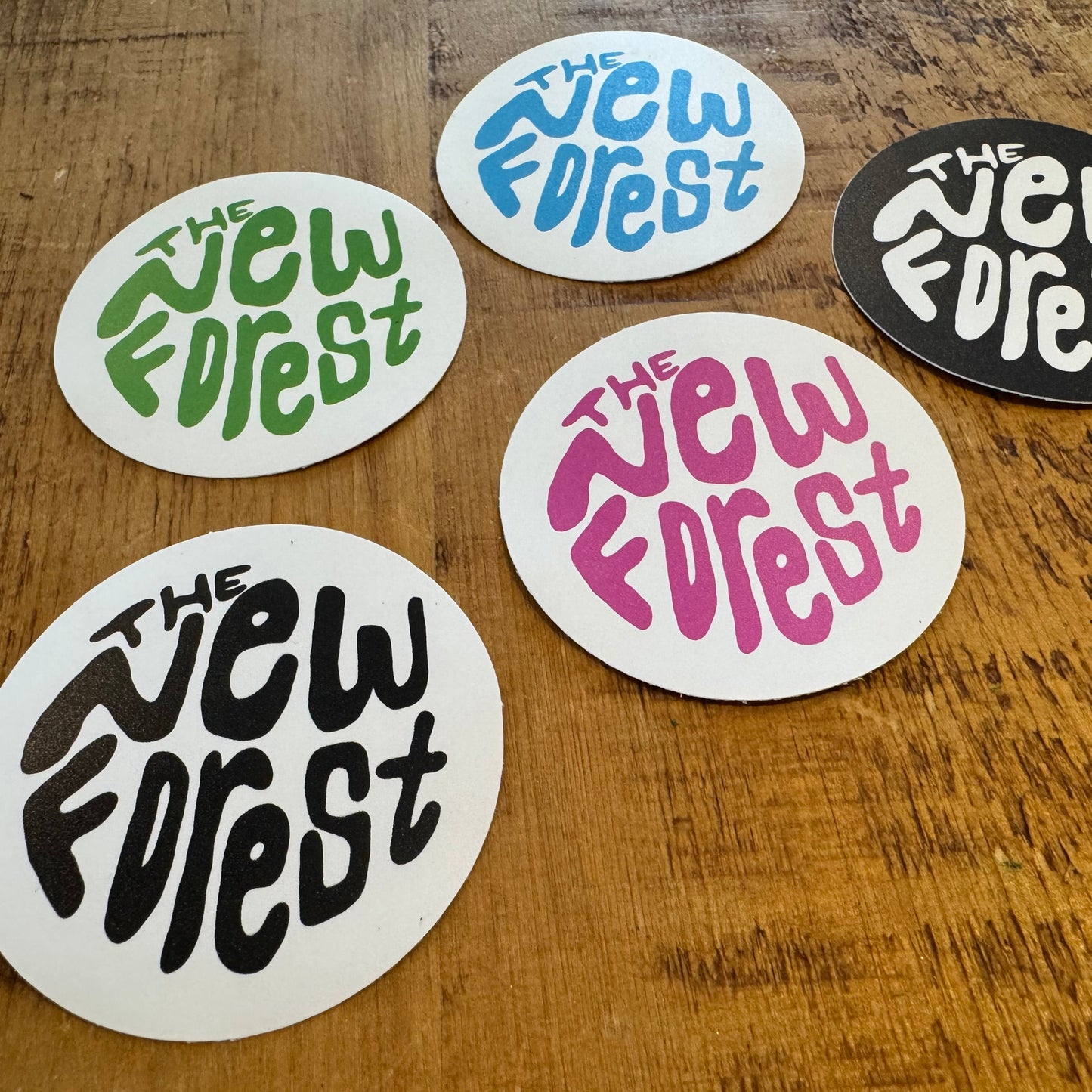 The New Forest Typography Circle Sticker (Solid) Set on Desk