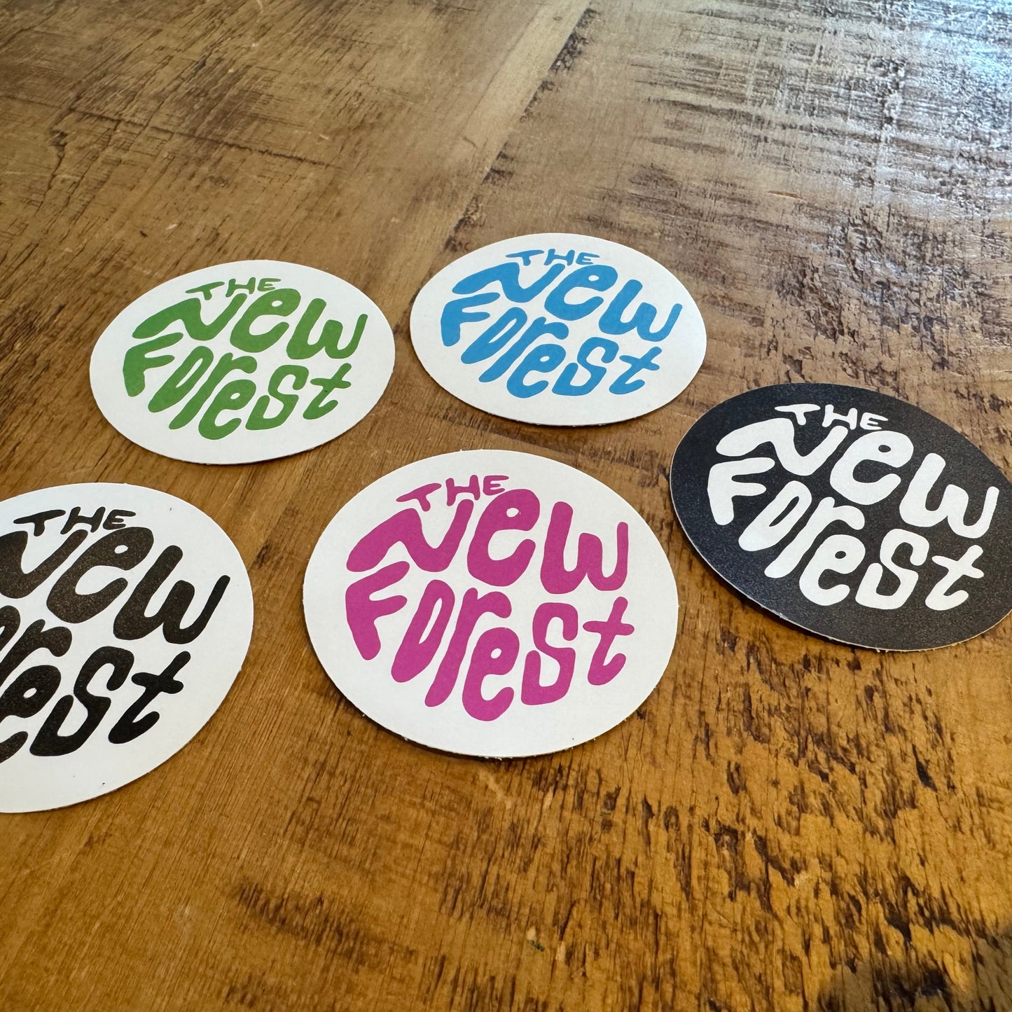 The New Forest Typography Circle Sticker (Solid) Set on Desk