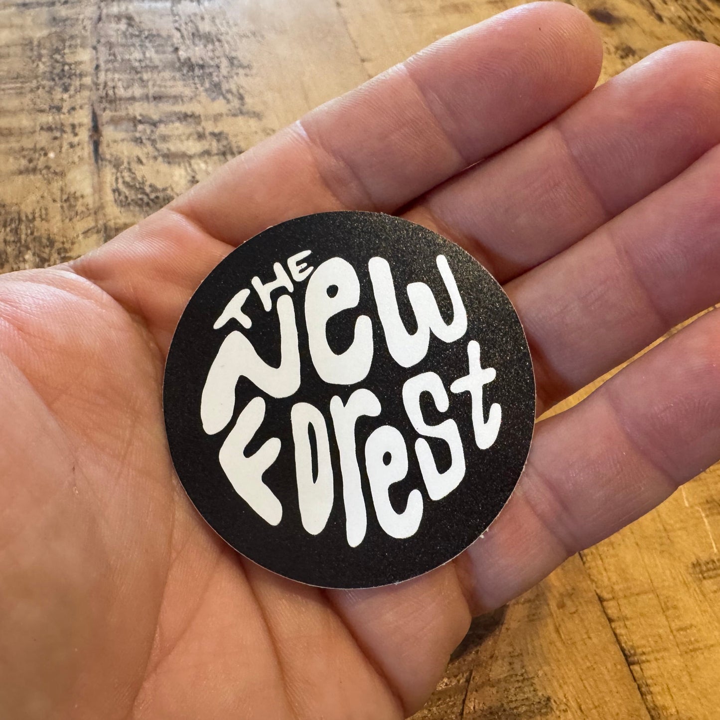 The New Forest Typography Circle Sticker (Solid) White/Black in Hand